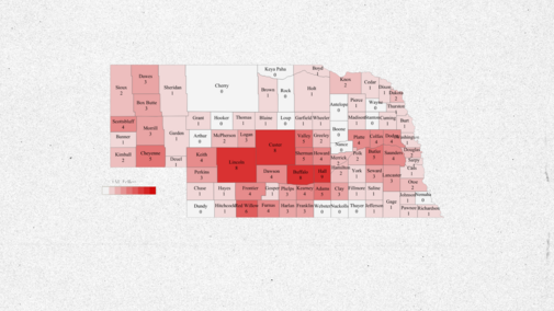 Nebraska county map with varying shades of red indicating data intensity.